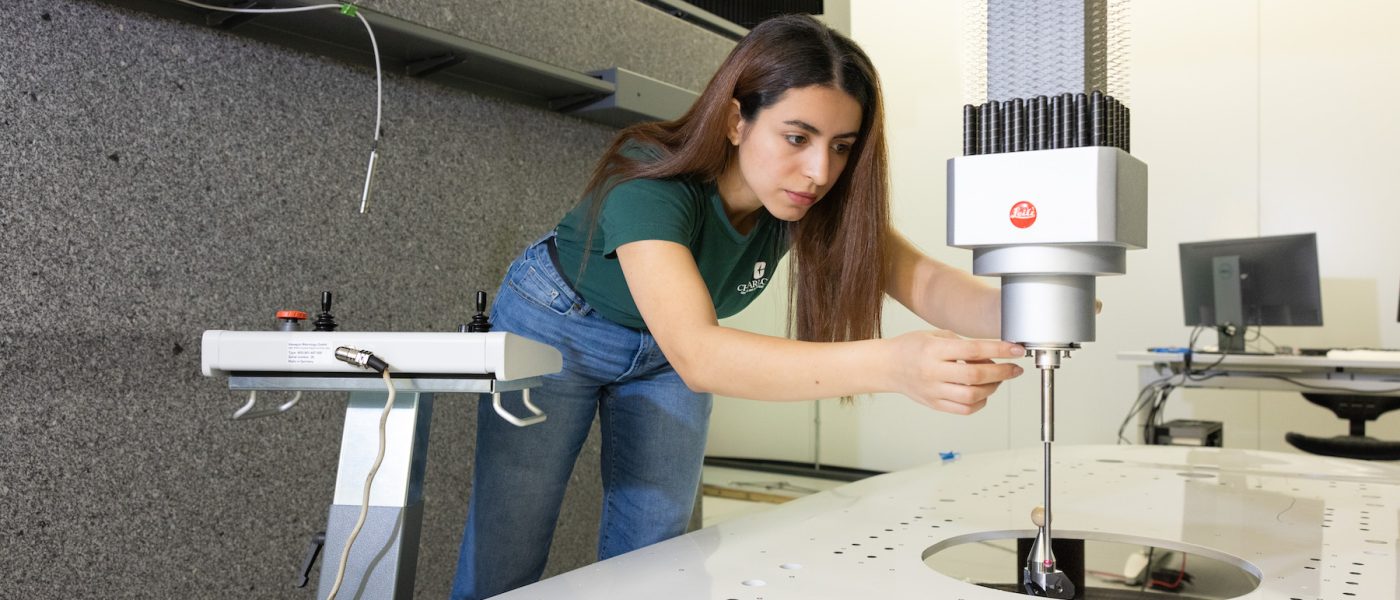 Doctoral student working on measurements
